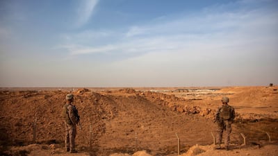 A handout photo made available by the US Marine Corps shows US Marines inside the perimeter of Al Asad Air Base in Iraq. EPA