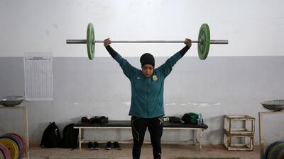 Huda Salem, an Iraqi national-level weightlifter, trains at a gym in Baghdad. AFP