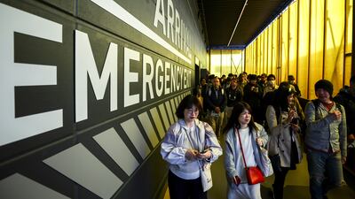 People arrive in the Gundam pavilion