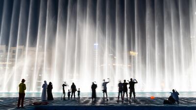 Visitors can enjoy an almost immersive experience of water and light at the Dubai Fountain. Photo: Alamy