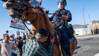 The National Guard, police and protesters clash following two days of protests after a series of immigration raids. AFP