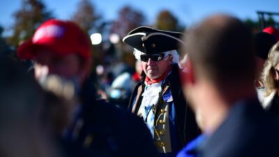 Ron Briggs dresses as George Washington on Halloween to attend a rally with President Donald Trump in Newtown, Pennsylvania. With the election only three days away. AFP